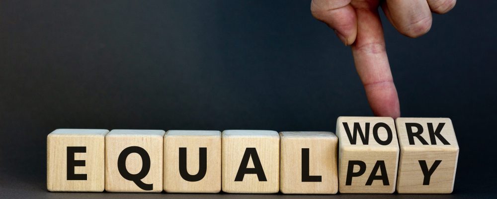 Equal,Pay,And,Work,Symbol.,Businessman,Turns,Wooden,Cubes,And